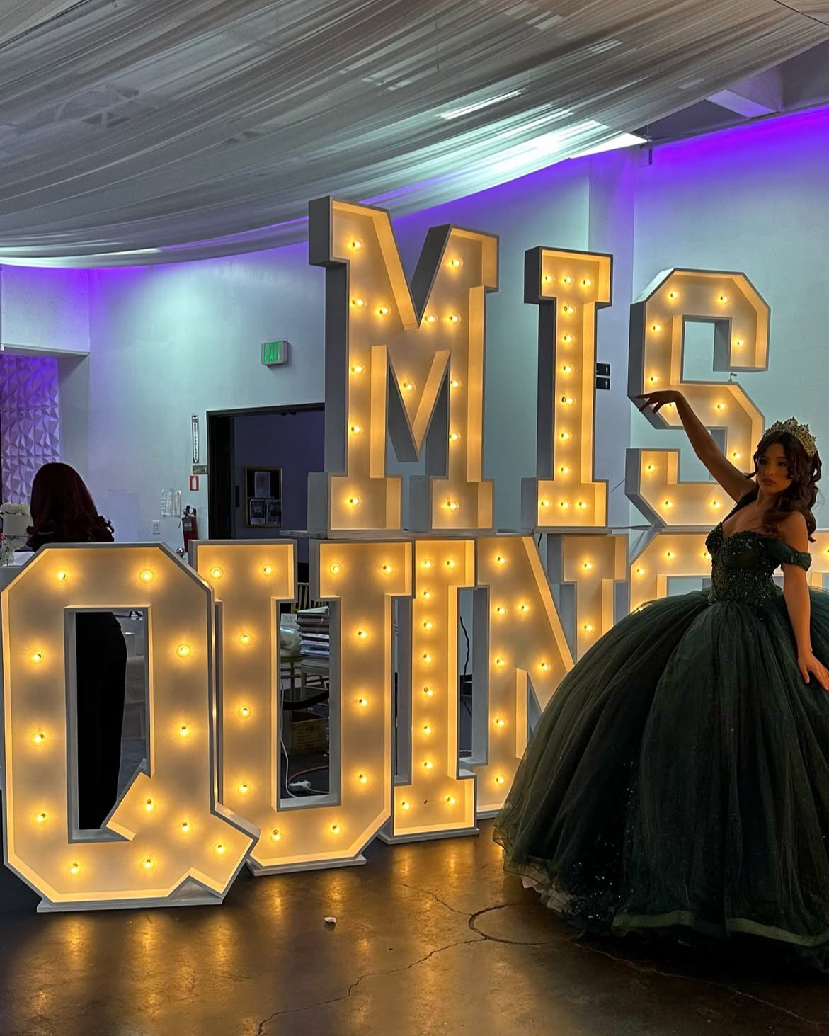 Illuminated marquee letters at a celebration